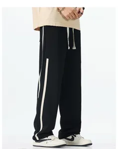 Casual wide-leg sweatpants detail view featuring contrast side stripes and comfortable straight fit.