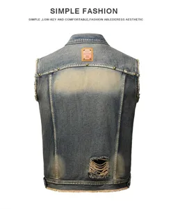 Back detail of vintage washed men's denim vest with distressed rips and metal studs.