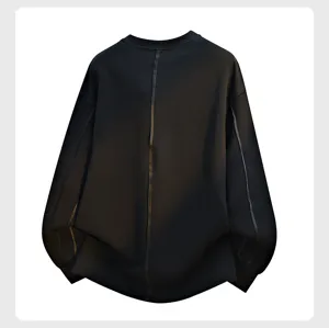Black crewneck sweatshirt back detail showing vertical decorative line and long sleeves.