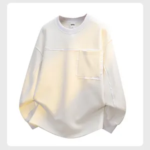 Detailed view of the casual crewneck sweatshirt featuring a chest pocket and raw edges.