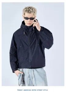 Detailed view of the American retro hooded workwear jacket, showcasing front zipper and drawstrings.