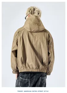 Detail view of the men's casual hooded cargo jacket in classic khaki, showing back fit.