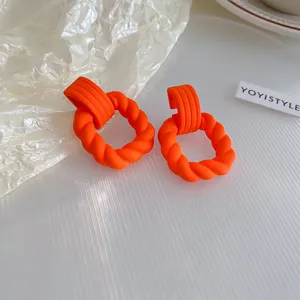 Stylish bright orange acrylic geometric hoop earrings for women, modern minimalist daily jewelry.