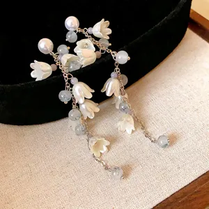 Exquisite silver needle white flower pearl tassel earrings, elegant fairy style detail view.
