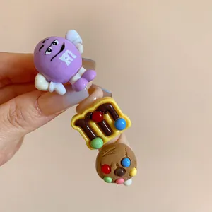 Detailed shot of cute colorful M&M style cartoon hair ring, sweet style accessories detail.