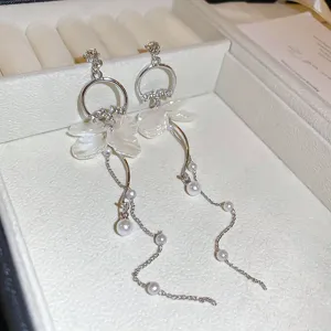 Elegant white flower tassel pearl earrings featuring crystal drop chains for women fashion jewelry.