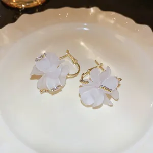 White flower earrings with sparkling rhinestone accents, elegant resin floral studs for women.
