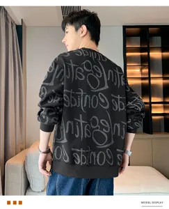Detailed view of men's black long sleeve sweatshirt with cool grey graffiti print design.