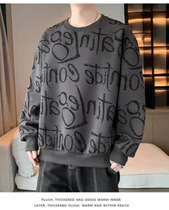 Close-up detail of thickened fleece sweatshirt featuring all-over graffiti letter print.
