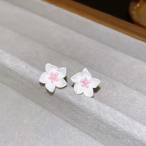 Exquisite white flower stud earrings with delicate pink beaded pistils, sweet forest style detail shot.