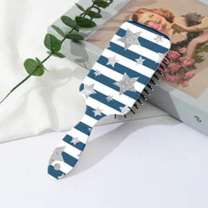Brosse à cheveux coussin rayée bleu et blanc avec étoiles pailletées argentées pour massage.