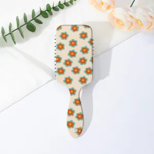 Retro floral print cushion hair brush anti-tangle scalp massage styling comb detail view.
