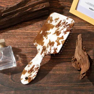 Cow print cushion paddle hairbrush scalp massage anti static ABS hair styling comb for women.