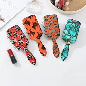 Western cowboy and turquoise print cushion hairbrush for daily scalp massage and hair styling.
