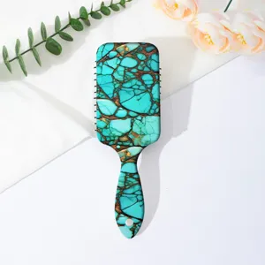 Turquoise marble pattern cushion hair brush for daily scalp massage and hair styling.