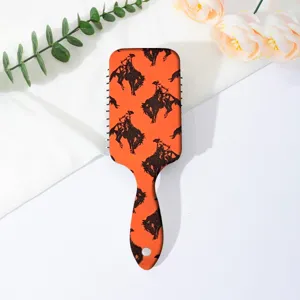Portable orange western cowboy pattern air cushion hair brush for daily scalp massage use.