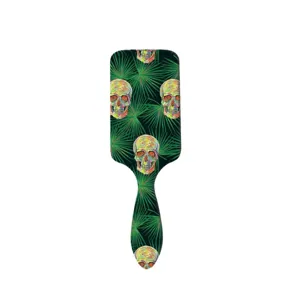 Spazzola per capelli teschio di Halloween con design colorato e foglie di palma per massaggio.
