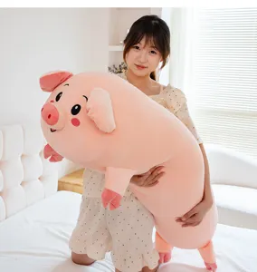 Cute pink pig plush long body pillow, soft stuffed cartoon animal cushion for sleeping.