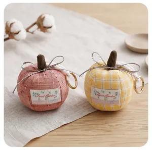 Cute fabric pumpkin apple pendant keychain with bow decoration, perfect for car or bag use.