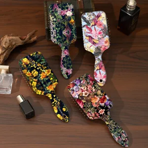 Floral paddle hairbrush with botanical print, wet and dry anti-tangle massage comb detail.