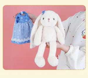 Cute fluffy floppy eared bunny plush toy with blue dress, soft stuffed animal doll gift for kids.