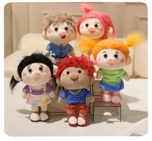 Close-up detail shot of cute funny curly hair plush dolls, soft toy figurines collection display.