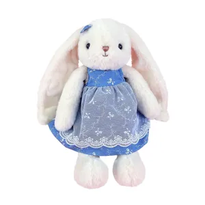 Cute floppy ear bunny plush toy wearing blue floral dress, soft stuffed animal doll for kids.