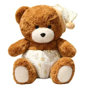 Cute brown teddy bear plush toy with sleeping cap and floral pants, soft doll gift.