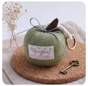 Cute green apple plush keychain with bow, perfect car rearview mirror hanging pendant decor.