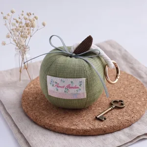 Cute apple plush pendant keychain with bow and metal ring for car decoration and keys.