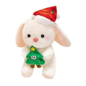 Bonito peluche de conejo de Navidad juguete con arbolito ideal para regalo festivo.