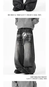 Details of the black washed baggy wide leg denim pants, showcasing the retro streetwear fit.