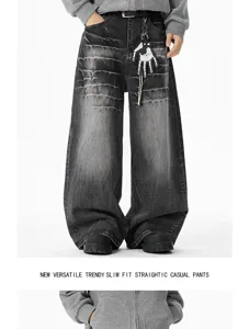 Distressed wide leg baggy jeans detail showcasing vintage acid wash finish and unique skeleton hand.