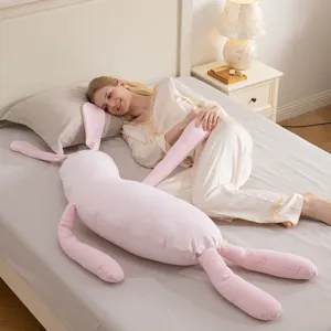 Pink striped long rabbit plush body pillow for side sleeping and cute bed decor.