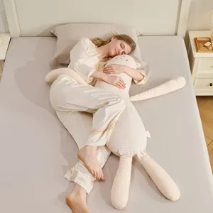 Cozy long plush rabbit hugging pillow for comfortable side sleeping, soft bed companion.