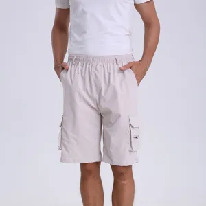 Mens casual cargo shorts detail view, light beige color, elastic waistband and side pockets.