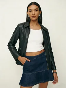 Stylish women's black leather jacket paired with white top and denim skirt for modern daily wear.