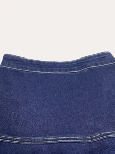 Dark blue denim skirt waist detail, high quality fabric with yellow contrast stitching.