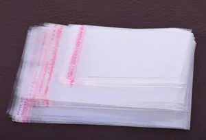 Transparent self-adhesive OPP plastic bags detailed view, ideal for jewelry storage and small parts.