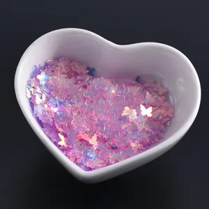 Shiny pink butterfly nail sequins, holographic glitter flakes for DIY art crafts.