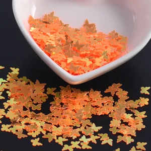 Gold butterfly nail sequins glitter flakes for DIY manicure art and nail design decoration.