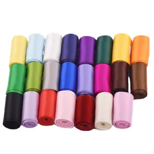 Colorful double faced satin ribbon rolls for gift wrapping and DIY craft decor.