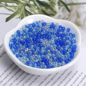 Transparent iridescent bubble beads detail, colorful pearl round beads for craft decoration.