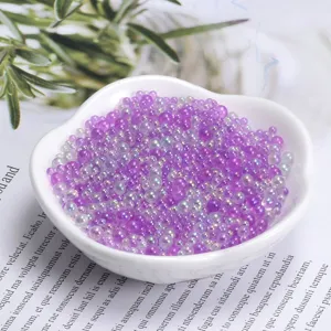 Close-up detail of mixed size transparent bubble beads in heart dish for DIY crafts decor