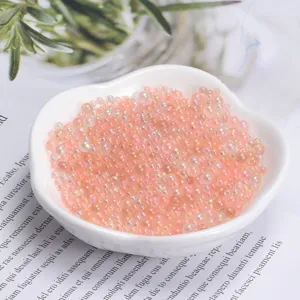 Mixed size translucent iridescent bubble beads for slime crafting, resin art, and DIY decor.