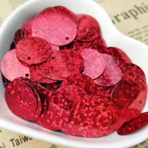 Close-up detail of red holographic round sequins, perfect for DIY crafts and clothing decor.