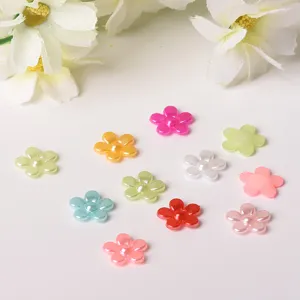 Colorful five petal flower pearl cabochons craft detail view for phone case DIY decor.