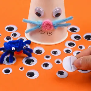 Black and white googly eyes with adhesive for kindergarten DIY craft projects and accessories.