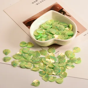 Light green iridescent shell sequins, DIY craft paillettes for clothing and handmade decoration.