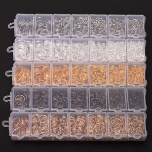 Detailed view of DIY jewelry making jump rings assorted in clear plastic storage boxes.